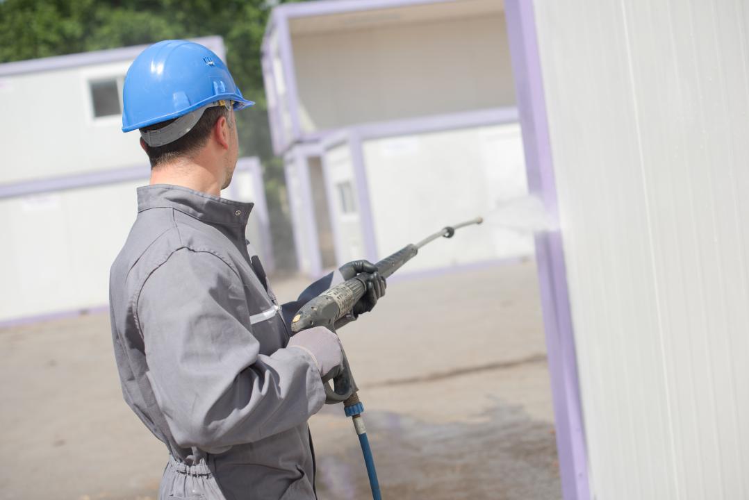 Power washing a building